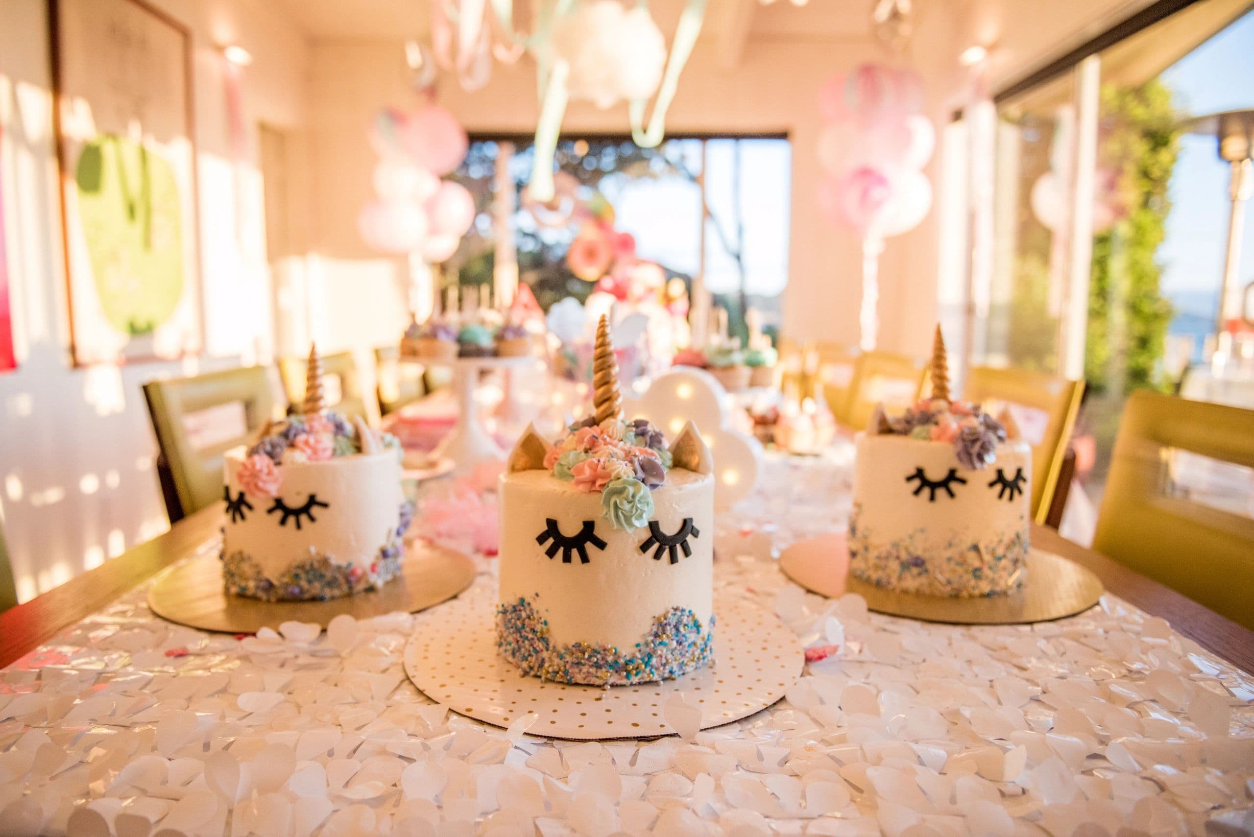Beautiful unicorn cakes with sprinkles and floral decorations